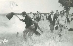 Summer 1976 and people help fight grass fires. Location unknown.