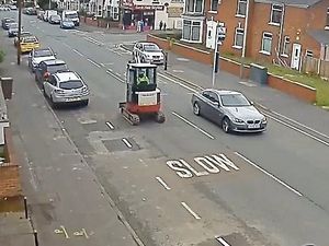 Supporting image for story: WATCH: Thief trundles down busy Wolverhampton road in stolen £25k DIGGER