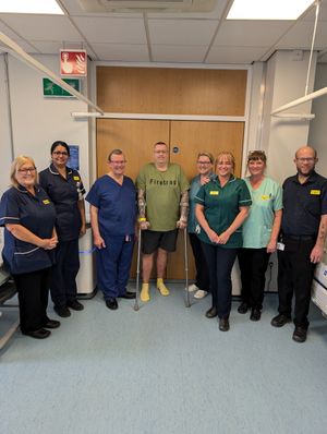 Neil Jones, pictured with staff and his surgeon Ralph Perkins.