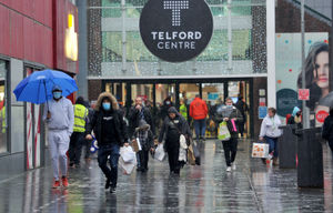 Shoppers brave the bad weather to do last-minute Christmas shopping in Telford