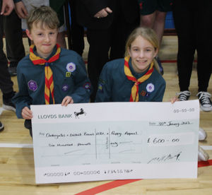 Finn Godwin and Isla Franks with the cheque.