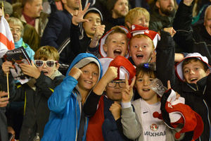 Young fans celebrate the glorious win.