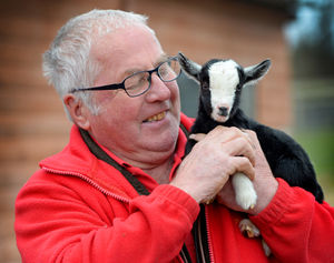 Tony Scott, from Scotty's Donkey and Animal Park, Norton, with a new born baby pygmy goat. He believes it is the smallest one they have ever seen as it stands at only seven inches tall