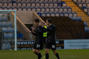 Josh Ruffels and Tom Sang applaud the travelling supporters. Picture: Ollie Jones