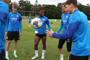 Albion players enjoy a joke during training (Photo by Adam Fradgley/West Bromwich Albion FC via Getty Images).