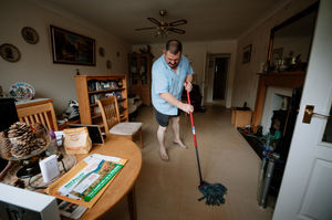 Stephen Watson cleans up over in Waterloo Road, Ketley, where homes were flooded