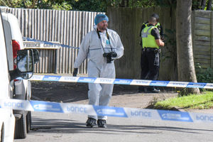 A forensic officer at the stabbing scene. Photo: SnapperSK