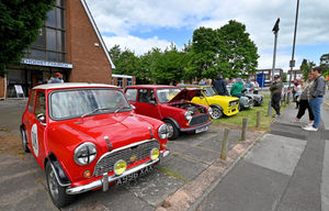 A row of classic minis sit outside Brownhills Methodist Church