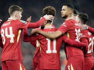 Cody Gakpo, centre right, celebrates scoring Liverpool's first goal