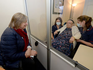 Supporting image for story: Joy as Shropshire care home residents reunited with family thanks to purpose-built visiting pod