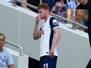 Tottenham’s Dejan Kulusevski is taken off after receiving treatment