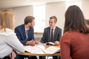 Ben Brennan with sixth formers at The Hart School 