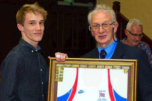 Telford AC's Jack Finn receives his award from John Bradley