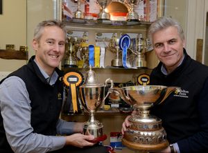 Mike Hutchins and Justin Beckett with some of the awards Belton's cheese has won