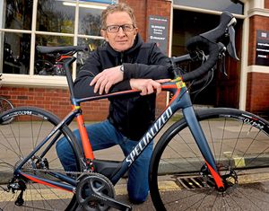 Dave Mellor outside his shop in Shrewsbury. He fears events could be cancelled because of the pothole danger.
