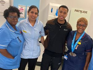Supporting image for story: Villa star lifts spirits by visiting Black Country hospital where his mother works
