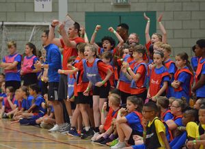 Youngsters cheering on their classmates