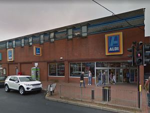 Supporting image for story: Woman attacked as masked gang flee from Aldi robbery