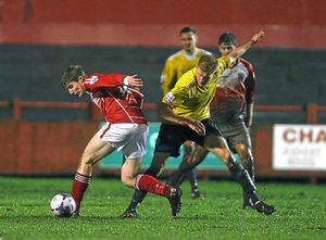 Conor Tinnion of Workington and Mike Grogan of AFC Telford United