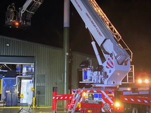Supporting image for story: Firefighters battle biomass building blaze near Market Drayton