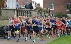 Philip Boak, front right, started the race strong and went on to finish first with a personal best time of 33:14