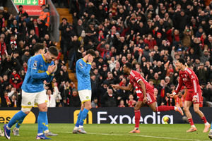 Liverpool's Dutch midfielder #38 Ryan Gravenberch (C) celebrates after scoring the opening goal of the English Premier League football match between Liverpool and Wolverhampton Wanderers at Anfield in Liverpool, north west England on December 27, 2025. (Photo by Oli SCARFF / AFP via Getty Images) / RESTRICTED TO EDITORIAL USE. No use with unauthorized audio, video, data, fixture lists, club/league logos or 'live' services. Online in-match use limited to 120 images. An additional 40 images may be used in extra time. No video emulation. Social media in-match use limited to 120 images. An additional 40 images may be used in extra time. No use in betting publications, games or single club/league/player publications. /