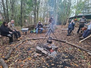 The veterans group enjoying a break around the fire