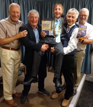 Giving outgoing president David a memorable lift-off in celebration of his two-year term in office are fellow Rotarians Gareth Watkins, Fred McDonogh, Johnathan Callwood and Colin Sharp.