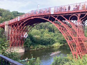 Crowds line the Iron Bridge to watch thw baton pass underneath on the River Severn. Photo: Sue Austin