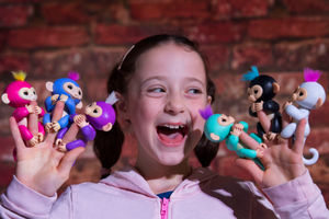 Abigail Silverlock, 9, plays with the Fingerlings toy during the unveiling of the annual DreamToys list compiled by an independent panel of retailers