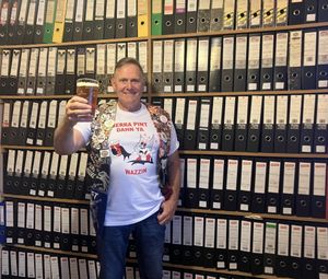 Peter Hill with his extensive collection of folders documenting all the pubs he has visited