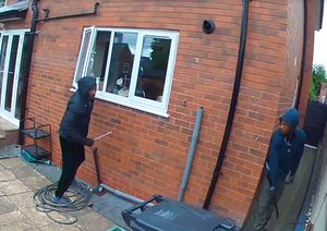 The men can be seen checking if they are being watched