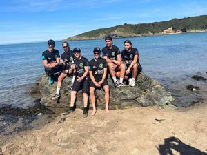 The Unskateables celebrating their journey's end in Cemaes Bay. Photo: Bethan Scott