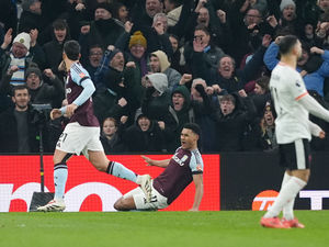 Aston Villa celebrates his goal against Liverpool