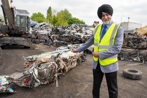Councillor Bhupinder Gakhal with the crushed van