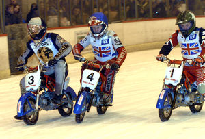 The Monkey Ice Bikes race around the ice rink circuit during the interval of the International Ice Speedway event.
