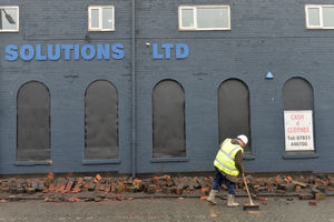 Council workers clear the fallen bricks