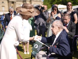 The Duchess of Gloucester meets 102-year-old veteran, Harry Winter, during the Not Forgotten Association Annual Garden Party at Buckingham Palace in London (Aaron Chown/PA)