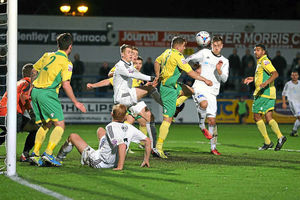 Adam Farrell of AFC Telford United heads this chance towards goal from a United corner.