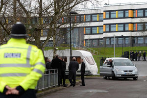 Police supervise the removal of travellers from the school car park at the Shenley Academy