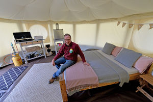 Owner Justin Hopley shows off one of the yurts on site. He said he was apprehensive, but also excited about the period coming up for the site