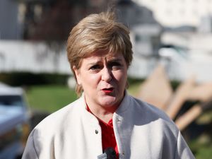 Nicola Sturgeon speaking in front of Holyrood