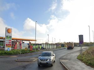 Supporting image for story: Firefighters tackle 'large quantity of rubbish being burned' near petrol station in Shrewsbury