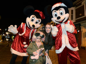 Samantha Driscoll with her three-year-old daughter Lila and Mickey and Minni Mouse.


