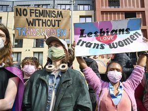 Protesters at a trans rights rally outside Queen Elizabeth House, the UK Government building in Edinburgh