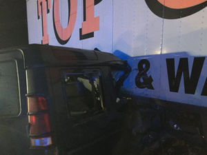 Supporting image for story: 'Extraordinarily lucky escape' as Land Rover ends up wedged under lorry