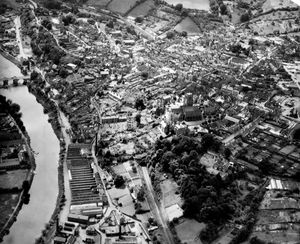 An undated Bridgnorth aerial view. St Leonard's Church is prominent and Bridgnorth High Street runs diagonally across the photo. Bridgnorth railway station is at the top and trains and rolling stock are visible, suggesting this was taken before the closure of the line in 1963 when it closed to through passenger (September) and freight (November) services. The line can also seen to be intact in the foreground, so the picture was taken before the track north of Bridgnorth was ripped up some time after September 1963. Picture: Aerofilms and Aero Pictorial Limited.