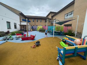 Sam doing steps in the hospital play ground
