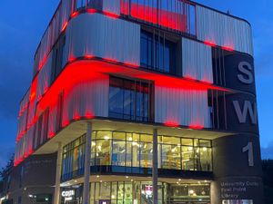 Supporting image for story: Telford's Southwater One lights up in red to support events industry