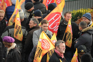 Firefighters demonstrate outside West Midlands Fire Service headquarters in Birmingham